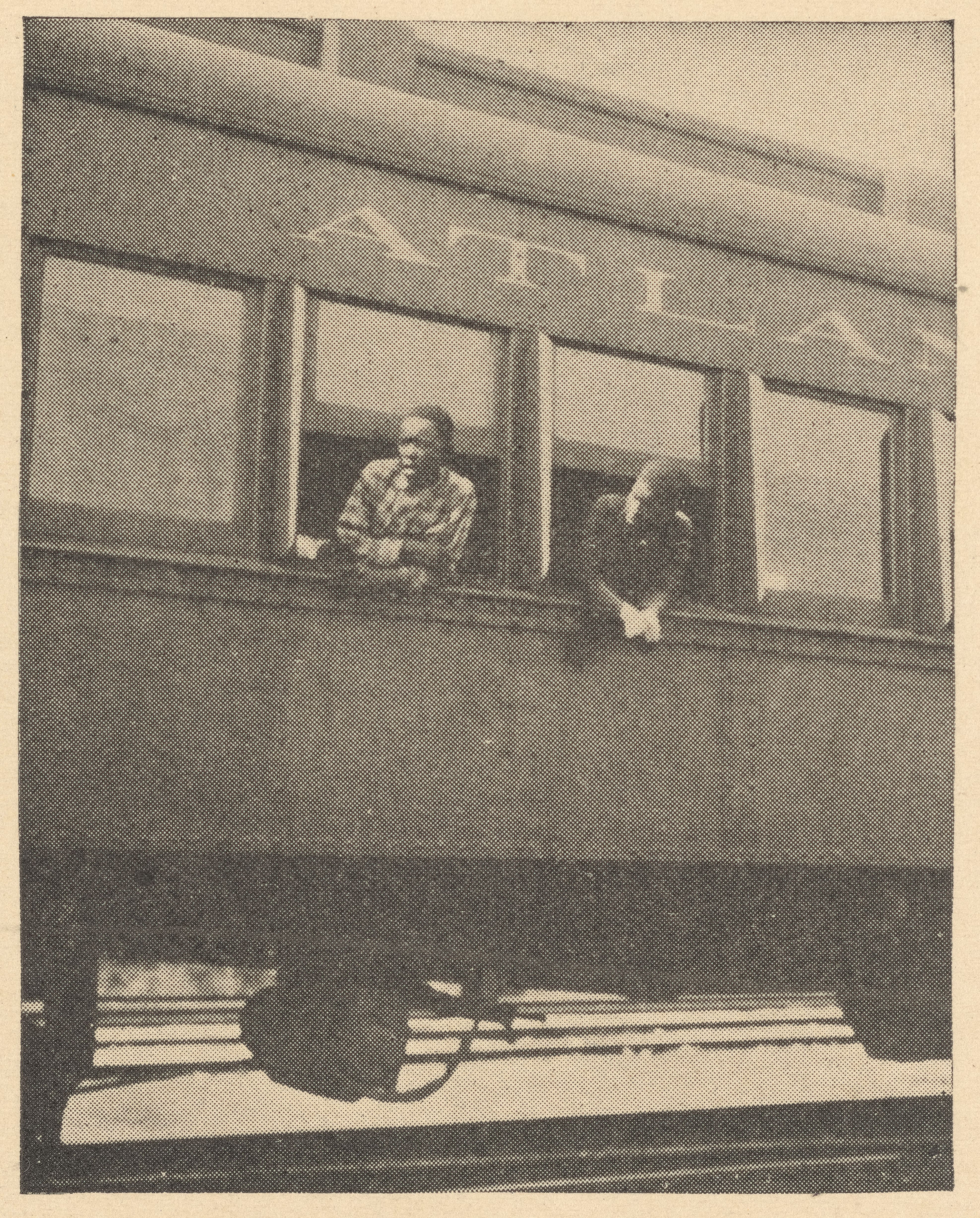 Two men on a train leaving North Carolina in 1929. Photo courtesy of New York Public Library.
